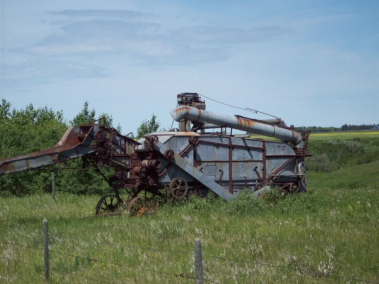 Old threshing machine in a field, 2008